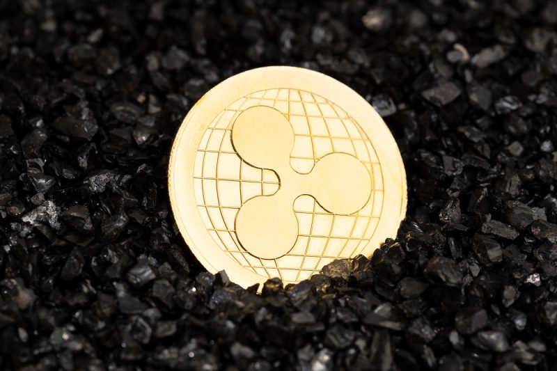 2-ripple-xrp-coin-on-black-gravel-background-2021-11-06-01-46-24-utc.jpg